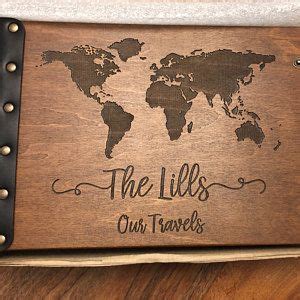 a wooden sign with the words, the lies our travels and a world map on it