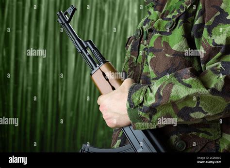 Man holding ak47 gun hi-res stock photography and images - Alamy