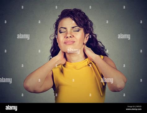 Young woman with neck pain Stock Photo - Alamy
