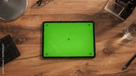 Top Down View of a Tablet Computer with Mock Up Green Screen Display. Static Footage of a Device ...