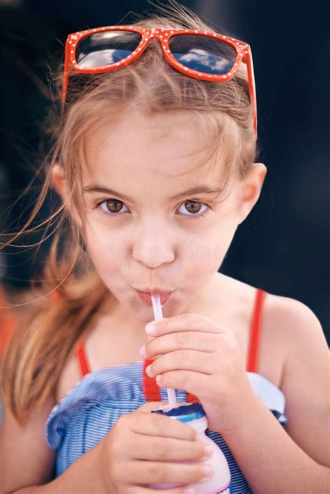 Child Enjoying a Tropical Drink at an Outdoor Pool Stock Photo - Image of beverage, drink: 49240312