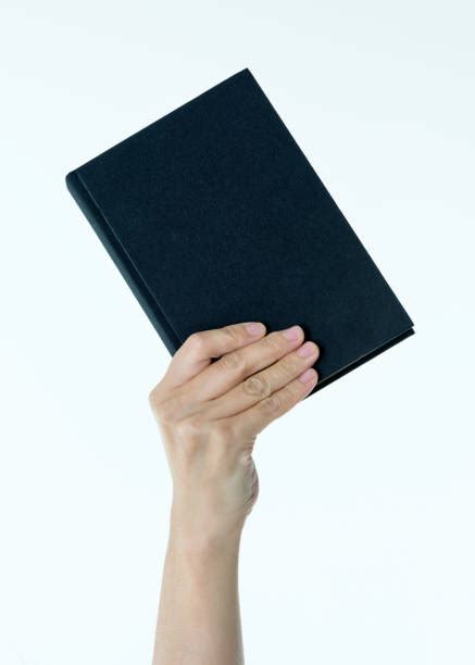 Hand Holding A Book Stock Photos, Pictures & Royalty-Free Images - iStock