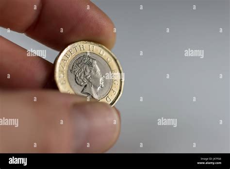 Holding the new British Pound coin sterling white background Stock ...