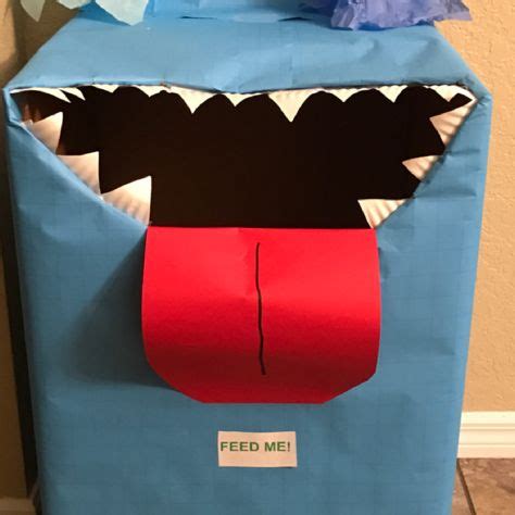 Feed the monster game made out of card board box and wrapping paper , construction paper and ...