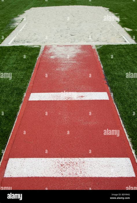 Jump athletics sand hi-res stock photography and images - Alamy