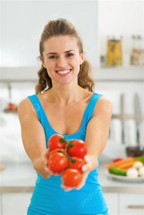 Smiling Young Woman Showing Bunch Of Tomato In Modern Kitchen Photo Background And Picture For ...