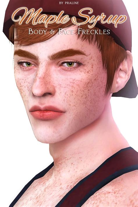 a man with freckles on his face wearing a cap and black tank top