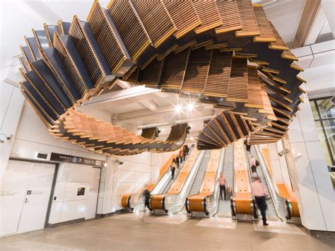 5 tons of vintage wooden escalator warped into spectacular subway sculpture