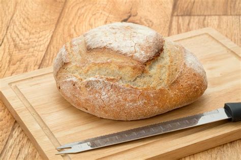 Rustic French Bread on a Cutting Board Stock Photo - Image of knife, food: 51085384