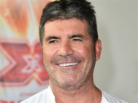 Simon Cowell shows off new teeth after e-bike accident | Canoe.Com