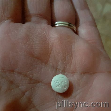 WHITE ROUND AN 627 - tramadol hydrochloride 50 MG Oral Tablet Pill Images