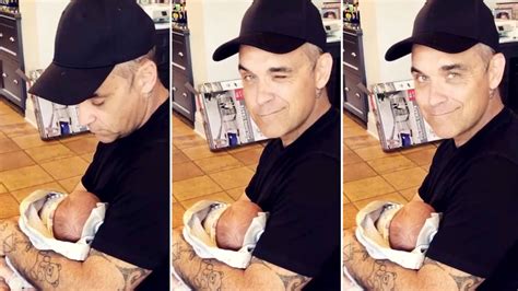 Robbie Williams cradles newborn son Beau in adorable video - Smooth