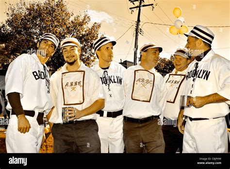 In vintage baseball uniforms, 6 baseball team members of ABBC Stock ...