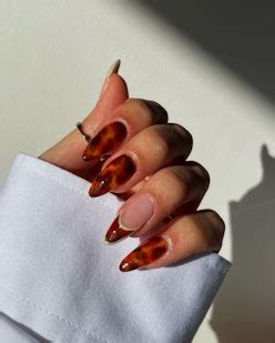 These Fall 2023 Nail Art Trends Are The Key To Elevating Your Manicure