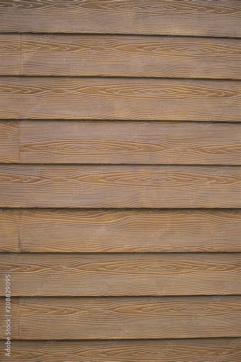 Brown Vinyl Siding Made to Look Like Wood Grain Stock Photo | Adobe Stock