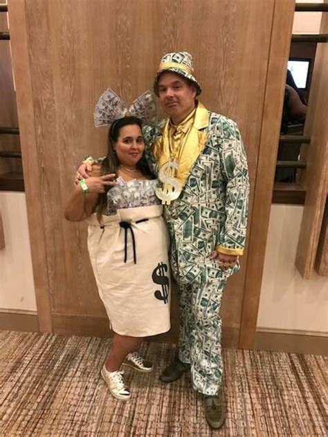 a man and woman dressed up in costumes