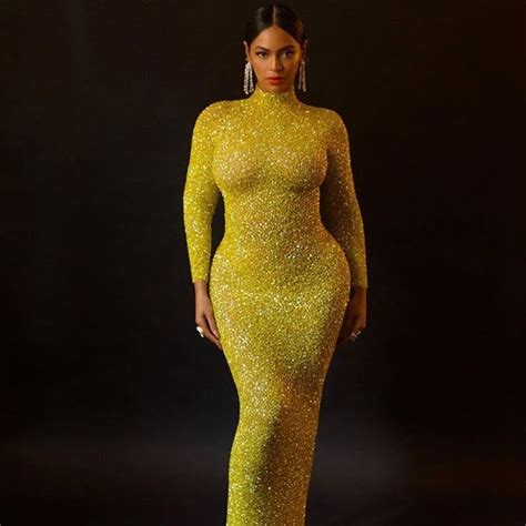 @beyonce serving ART in a floor length yellow crystal dress paired with a slicked back floor ...