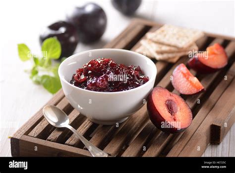 plum jam with the fruit around Stock Photo - Alamy