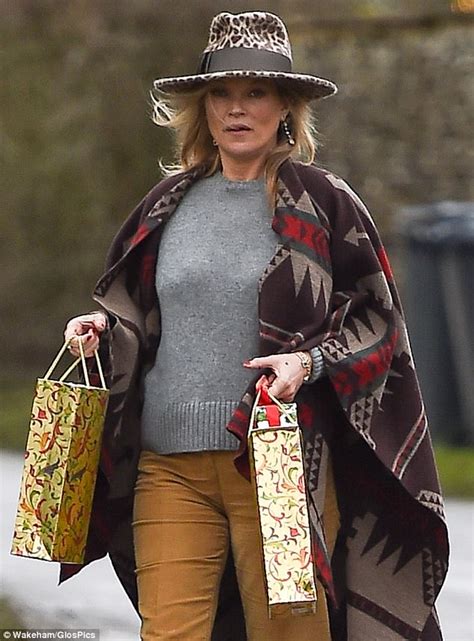 Boho Kate Moss delivers festive gifts to her neighbours | Daily Mail Online
