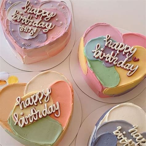 four heart shaped cakes with happy birthday written on them