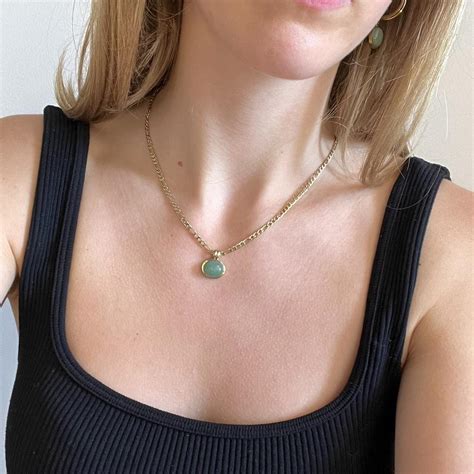 This elegant green gem stone necklace not only will... - Depop