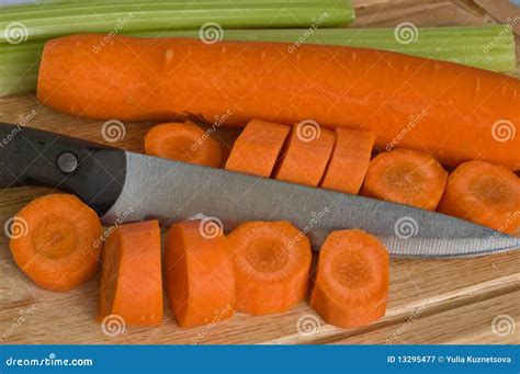 Knife cutting carrot stock image. Image of green, orange - 13295477