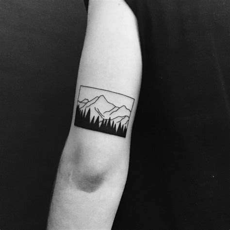 Beautiful minimal mountain tattoo by Chinatown Stropky - Tattoogrid.net