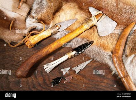 Stone Age Tools on wooden Background Stock Photo - Alamy