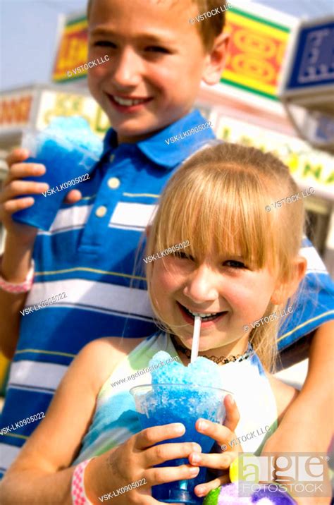 Kids eating carnival food, Stock Photo, Picture And Royalty Free Image ...