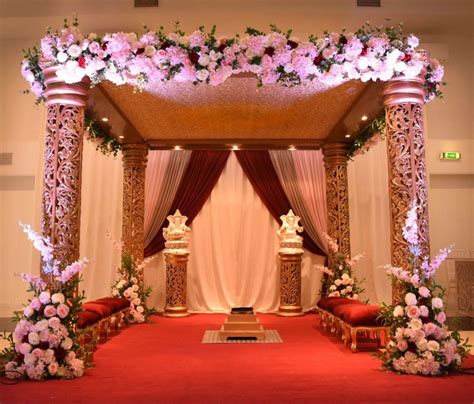 Golden Indian wedding mandap pink flower decoration | Indian wedding ...