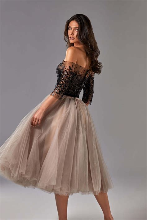 Dreamy strapless midi tulle dress in cappuccino color. The dress itself featured a semi ...