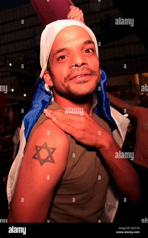 A young Israeli man showing his arm tattooed with the Jewish Star of David during a Right Wing ...
