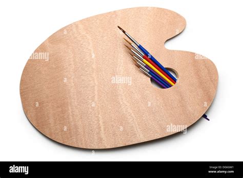 Clean wooden palette and paint brushes Stock Photo - Alamy