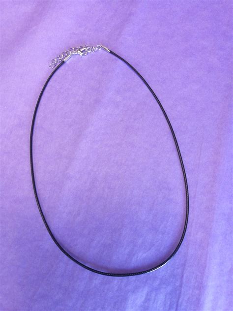 Black Cord Necklace - Angel on a Broomstick