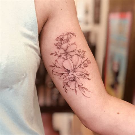 Magnolia and Lily of the Valley Tattoo