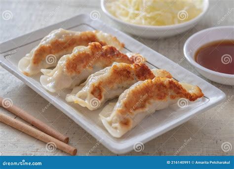 Fried Dumplings Gyoza on Plate and Soy Sauce Stock Image - Image of meat, sauce: 216140991