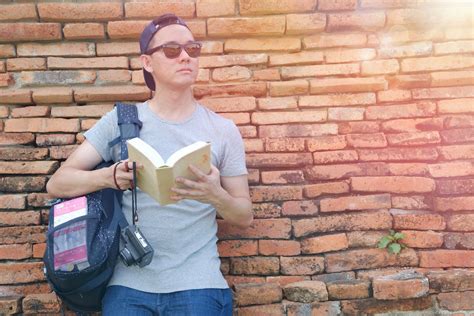 Man Holding Book Outdoor · Free Stock Photo