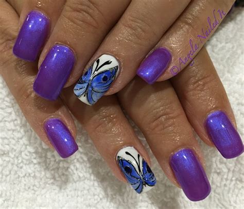 neon purple with hand painted butterfly gel nails | Butterfly nail art ...