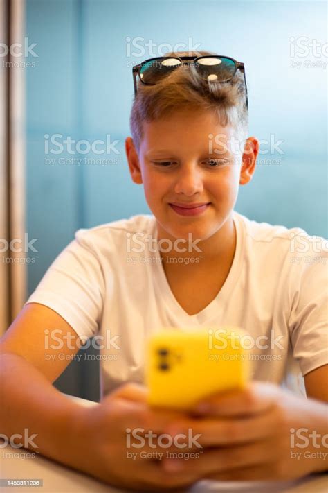 Teenage Boy Watching New Video Tutorial Online Stock Photo - Download Image Now - 10-11 Years ...