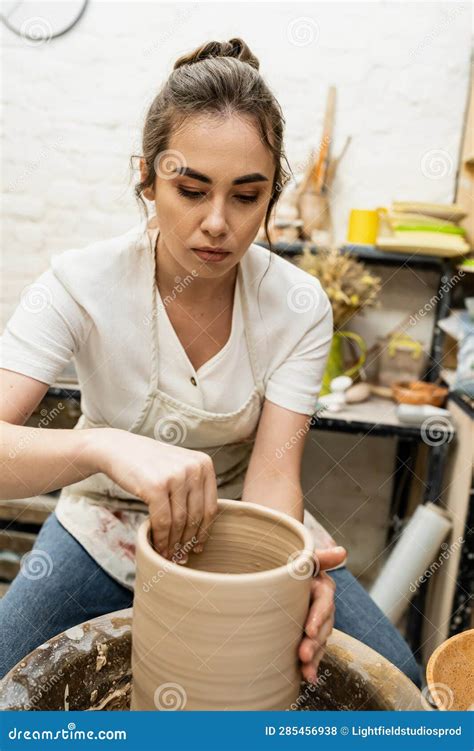 Brunette Craftswoman in Apron Shaping Clay Stock Photo - Image of sculptor, molding: 285456938
