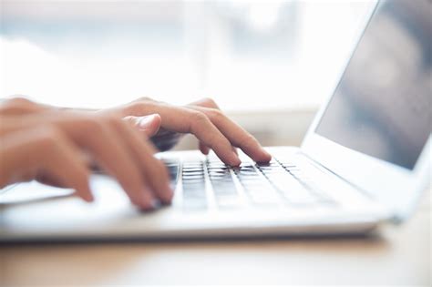 Free Photo | Close-up of male hands typing on laptop keyboard