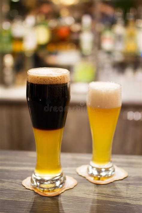 Glassed of Dark Beer and Lager Stock Photo - Image of drink, pint: 75320918