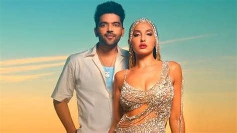 Nora Fatehi is a vision in silver cut-out dress with Guru Randhawa for Dance Meri Rani beach ...