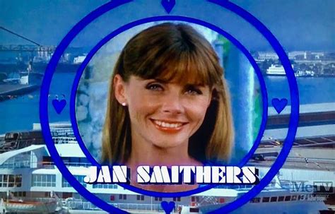 a woman smiling in front of a blue circle with the words jan smothers