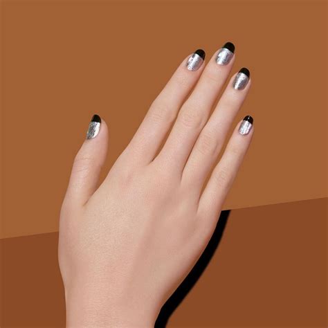 Switch up your classic French mani with a black glossy tip and silver base. | New Year’s Nails ...