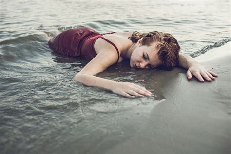 Dead Woman In Red Dress Lying In The River Stock Photo - Download Image ...