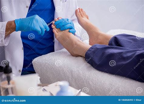 Podiatrist Treating Feet during Procedure Stock Photo - Image of ...