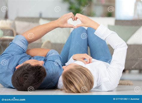 Couple Making Heart Shape with Hands at Home Stock Photo - Image of ...