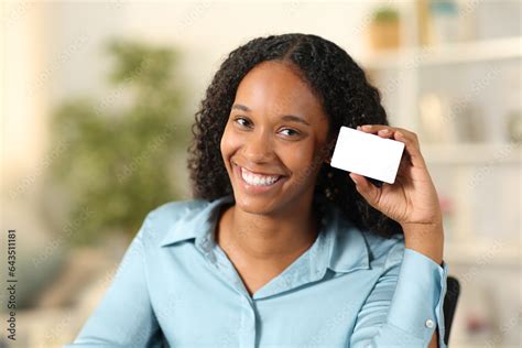Happy black woman showing blank credit card Stock Photo | Adobe Stock