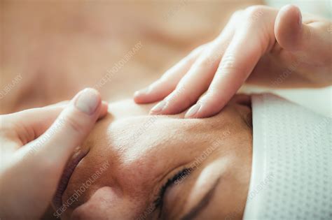 Face lifting massage - Stock Image - F037/5421 - Science Photo Library